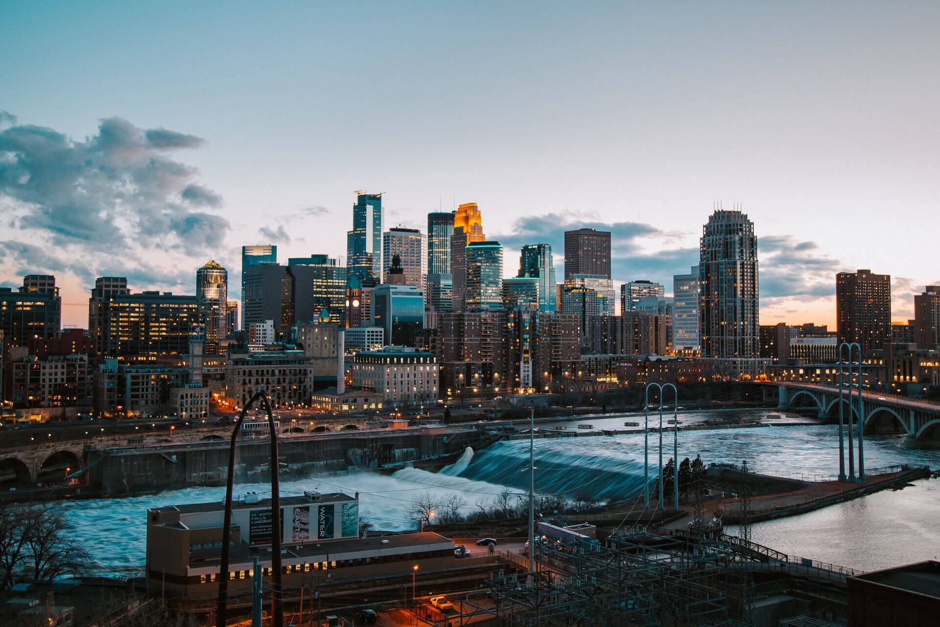 Downtown Minneapolis skyline at dusk along the Mississippi River